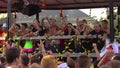 Revelers Dance and Party on a float near a crowd at Love Fest Street Parade