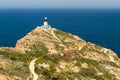 Revellata lighthouse with flowers and maquis in Corsica Royalty Free Stock Photo