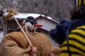 Reveller wearing wooden mask and carnival costume in Switzerland