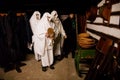 Revellers dressed as Lucky at Saint Lucy`s Day, Traditional historic country-style architecture in Skanzen, Polabi open-air