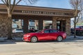 REVELSTOKE, CANADA - MARCH 17, 2021: beautiful red mazda on parking lot by Revelstoke dental centre building