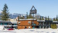 REVELSTOKE, CANADA - MARCH 15, 2020: hotel building in snow with mountains on background clear blue sky