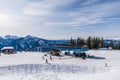 REVELSTOKE, CANADA - MARCH 17, 2021: people on downhill ski trail cable lift station