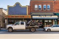 REVELSTOKE, CANADA - MARCH 16, 2021: street view in small town with historic buildings and modern cars early spring