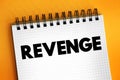 Revenge - hurt someone in return for being hurt by that person, text concept on notepad