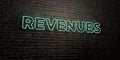 REVENUES -Realistic Neon Sign on Brick Wall background - 3D rendered royalty free stock image