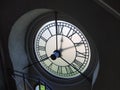 Revers side on the clock in old bell tower at ancient palace. Indoor view on the clock mechanism in tower.