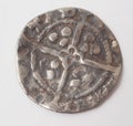The reverse of an English hammered silver Farthing coin from the period of Edward I 1279-1351