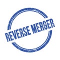 REVERSE MERGER text written on blue grungy round stamp