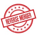 REVERSE MERGER text written on red vintage round stamp