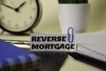 Reverse Mortgage on the paper isolated on it desk. Business and inspiration concept