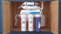 Reverse osmosis water purification system under sink. Water cleaning system installation