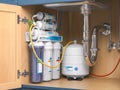 Reverse osmosis water purification system under sink in a kitchen. Water cleaning system installation