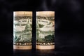 Reverse Sides of Folded Fifty Dollar Banknotes on Dark Background Royalty Free Stock Photo