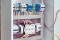 Reversible Assembly of two power contactors, phase control relays, circuit breakers in the electrical Cabinet
