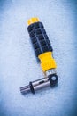 Reversible screwdriver with rubber handle on