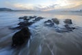 Reversing tide at sunset on a winter day Royalty Free Stock Photo