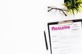 Review resumes of applicants set with glasses white work desk background top view mockup