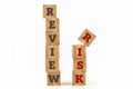 Review Risk word written on cube shape. Royalty Free Stock Photo