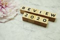 Review 2020 word alphabet letters on marble background