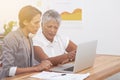 Reviewing their business strategy. two businesswomen working together at a laptop. Royalty Free Stock Photo