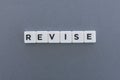 Revise word made of square letter word on grey background