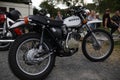 Revived Elegance: Restored 250cc Silver Honda Cross Leaning on Stand