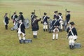 Revolutionary War re-enactors re-create the cannon fire and subsequent cease-fire of the British army, in which they flew the whit Royalty Free Stock Photo