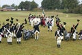 Revolutionary War re-enactors re-create the cannon fire and subsequent cease-fire of the British army, in which they flew the whit Royalty Free Stock Photo