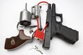 Revolver and automatic gun with cable lock , Locked disarmed and secured weapons , Gun safety in home concept Royalty Free Stock Photo