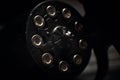 Revolver cylinder with Flobert ammo 4mm on dark wooden background