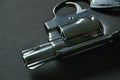 Revolver gun on black fabric background Royalty Free Stock Photo