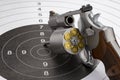 Revolver hand gun and bullets on bull eye target background