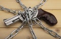 Revolver hand gun and metal chains on wooden background , Gun Control and safety concept Royalty Free Stock Photo