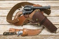 Revolver holster knive wood background