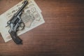 Revolver and money on the table Royalty Free Stock Photo