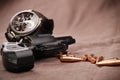 Revolver with watch and bullets