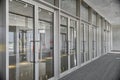 Revolving doors. The facade of a modern shopping center or station, an airport with revolving doors. Royalty Free Stock Photo