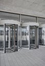 Revolving doors. The facade of a modern shopping center or station, an airport with revolving doors. Royalty Free Stock Photo