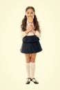 Rewarding herself with sweets. Food addictions. Girl kid eat sweet lollipop. Girl pupil school uniform like sweets
