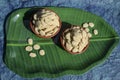 Rewri or Sesame seed sugar jaggery, Indian Sankranti festical food item. Rewri gajak served in earthen pot bowl on banana leaf