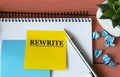 REWRITE - Word on a note sheet with a cactus in the background Royalty Free Stock Photo