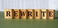 REWRITE - word on wooden blocks on light background