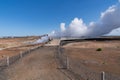 Reykjanes Peninsula, Iceland - July 11, 2023: Tourist stands in the hot steam of Gunnuhver Hot Springs