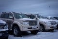 ReykjavikTwo used Toyota Landcruiser cars for sale, parked at an outdoor car market in winter.