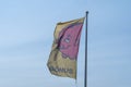 Bonus grocery store pig logo flag flies in the wind, advertising the Icelandic chain