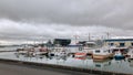 Reykjavik, Iceland - July 2, 2018: The Old Harbor marina, along with boats and Harpa concert hall at the background