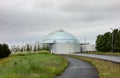 Building of Perlan on the top of the hill in Reykjavik, Iceland which is formed by six large water tanks with a road Royalty Free Stock Photo