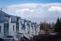 Row of white residential houses with blue roofs in Reykjavik, Iceland. Royalty Free Stock Photo