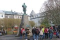 Reykjavik Iceland, May12 2018: Tourists gather around a statue in Reykjavik to read what it is about and take pictures